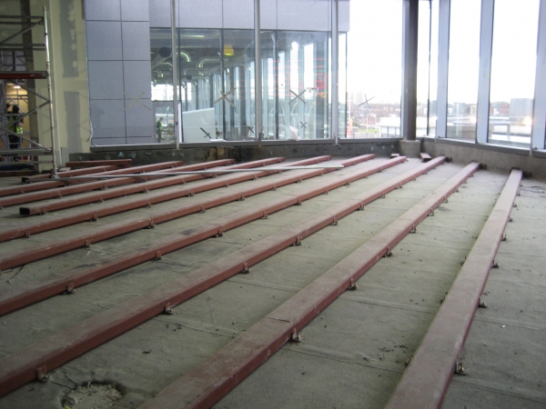 Steel beams strengthening the structural slab